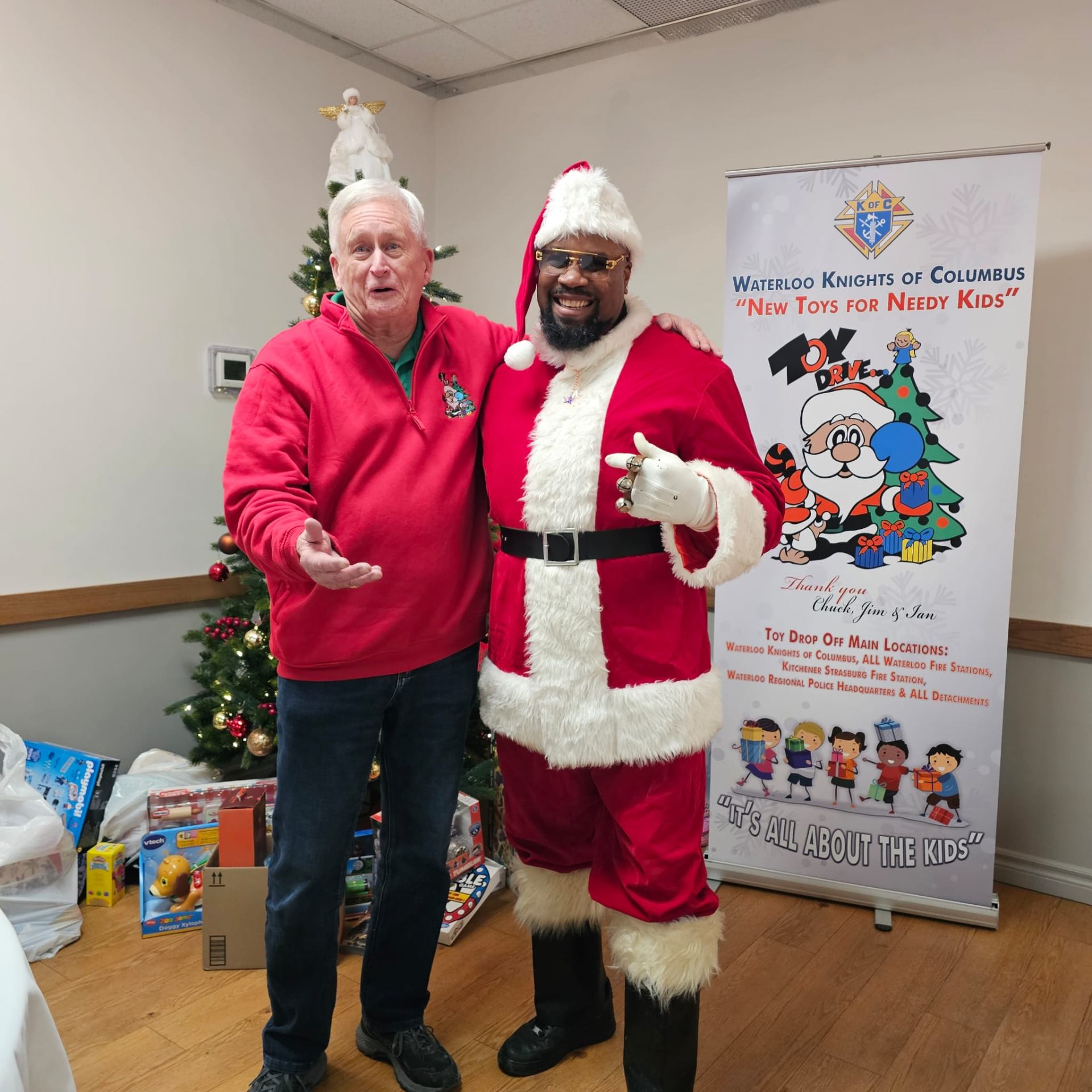 Fitz suited up as Santa with a Waterloo Knights of Columbus volunteer at the 'New Toys for Needy Kids' holiday toy drive